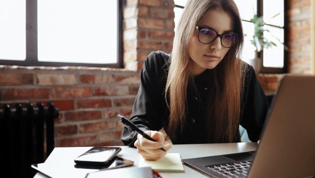 beautiful-young-woman-in-the-home-office-working-from-home-teleworking-concept-scaled.jpg